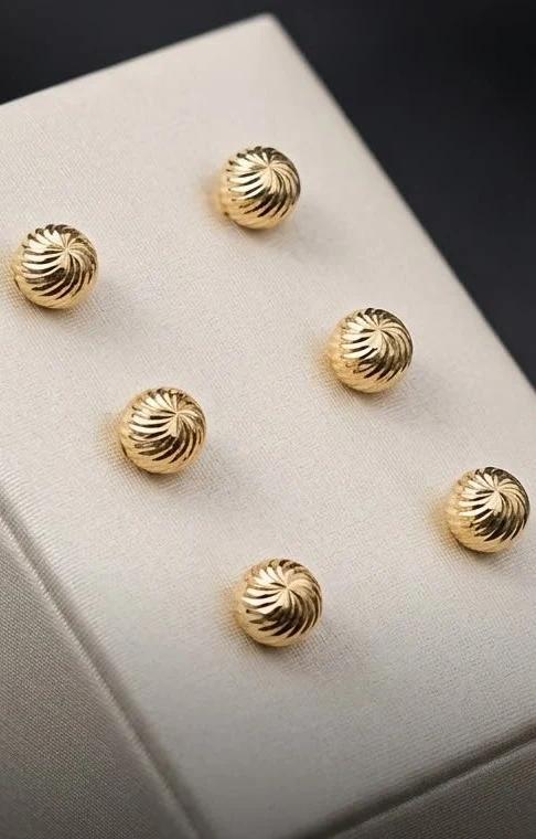 Topos balín de 7 mm en oro 18K